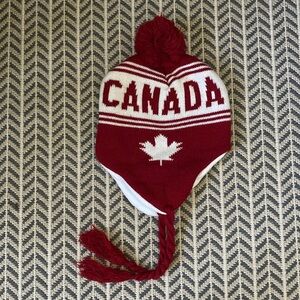 NWOT=CANADA UNISEX Red & White Knit Hat W/Ear Flaps/Polar Fleece lined & Ties